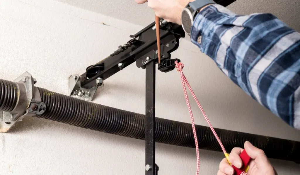 garage door slammed closed spring damage